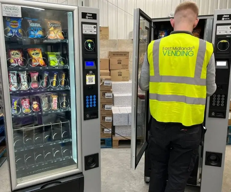 Technician Restocking a Machine for Our Vending Machine Company